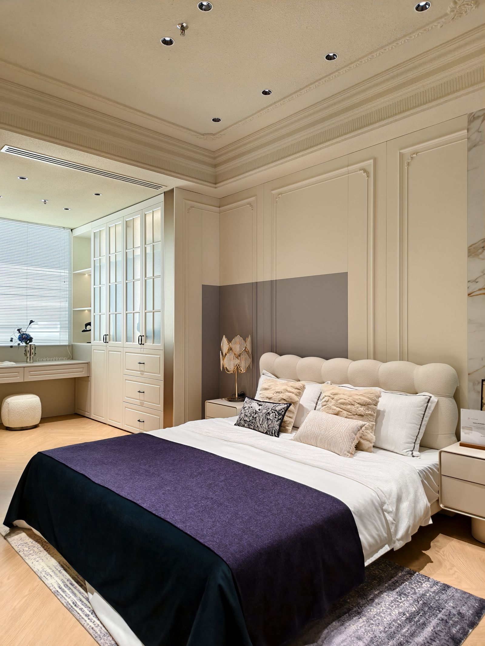 Contemporary classic bedroom with cream panelling, plum bedding and custom wardrobes by Art Ideas